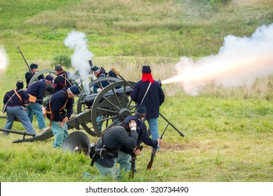 Unidentifiable Union Soldiers Fire A Cannon During A Reenactment Of The Civil War Battle Of Gettysburg.