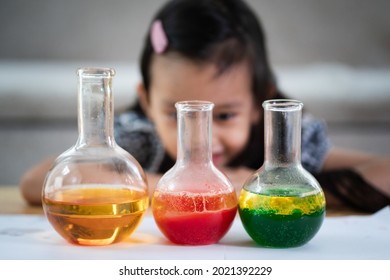 Unidentified 5 Years Old Student Is Observe The Water And Oil Separation For Liquid Density Easy Science Experimental At Home, Homeschool, Stem Education, Self Learning For Kid In Family Life.