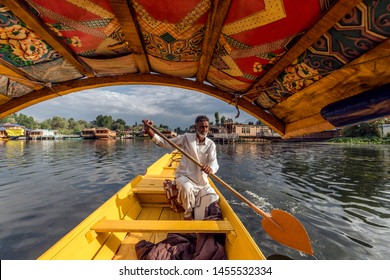unidentified boatman driving boat at Dal Lake, Sri Nagar, India on june 26, 2018