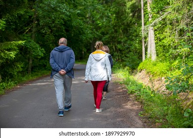 Unidentified Caucasian People Walking In The Park. Due To Covid-19 Situation Lots Of People Are Enjoying Fresh Air Outdoors Due To Restrictions.