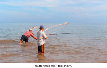 Unidentified fisherman throwing net in the sea on sunset - Mersin, Turkey