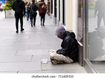 An unidentified homeless man begging on city street in Glasgow, Scotland.