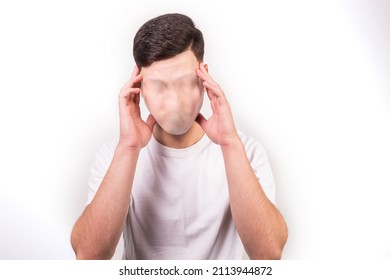 An Unidentified Man With No Face, In A White Tshirt Holding His Head, Isolated On White Background