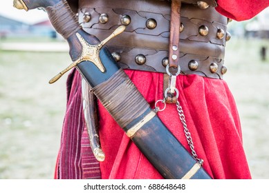 Unidentified Man With Sword In Retro Costume Of Ancient Turkish Troops And Ottoman Empire Soldier