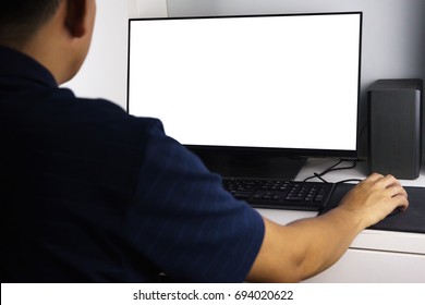 Unidentified Man Using Computer Desktop With A White Screen.  