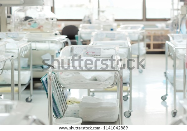 Unidentified new born babies in\
maternity hospital. Newborn and Childbearing center room in modern\
hospital. Newborn in INCU room. Concept of new life and Begin and\
start of life,\
Congratulations.