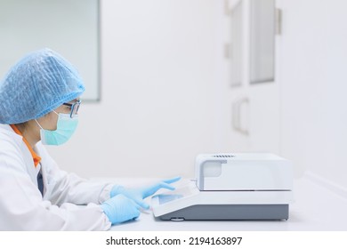 Unidentified Operator Or Chemist Is Testing Moisture Or Water Content In Sample With Automatic Moisture Balance In The Laboratory. Concept Of Quality Control In Pharmaceutical Industry.