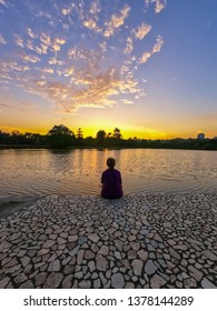 Unidentified People Site At The Park Seeing The Beautiful Sunset At Kota Kinabalu, Sabah, Malaysia