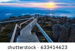 Unidentified people, sunrise time at The Pinnacle Observation Shelter and Boardwalk on Mount Wellington, Hobart Tasmania, Australia.