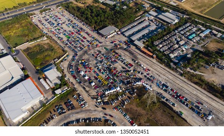 Unidentified people walking at car care shop and Automotive services in speed race track,  Crowd of people queue to pay at cars show
