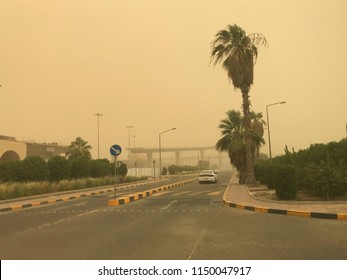 An Unidentified Person Is Driving A Car On The Road In Dust Storm Weather In Kuwait. Beauty Of Nature.