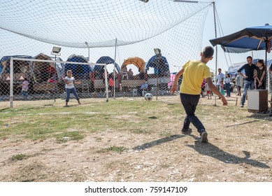 Unidentified Turkish Man Hitting Ball To Win Gift If He Scores A Goal To Woman Goal Keeper At Pavli Fair Festival In Kirklareli,Turkey 19 October,2017