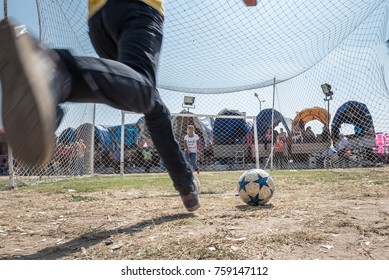 Unidentified Turkish Man Hitting Ball To Win Gift If He Scores A Goal To Woman Goal Keeper At Pavli Fair Festival In Kirklareli,Turkey 19 October,2017