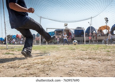 Unidentified Turkish Man Hitting Ball To Win Gift If He Scores A Goal To Woman Goal Keeper At Pavli Fair Festival In Kirklareli,Turkey 19 October,2017