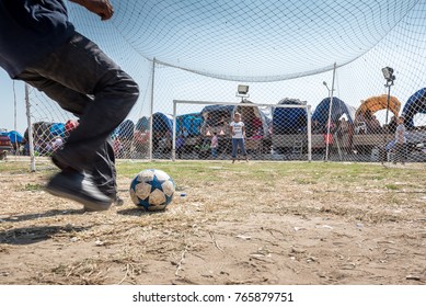 Unidentified Turkish Man Hitting Ball To Win Gift If He Scores A Goal To Woman Goal Keeper At Pavli Fair Festival In Kirklareli,Turkey 19 October,2017