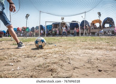 Unidentified Turkish Man Hitting Ball To Win Gift If He Scores A Goal To Woman Goal Keeper At Pavli Fair Festival In Kirklareli,Turkey 19 October,2017