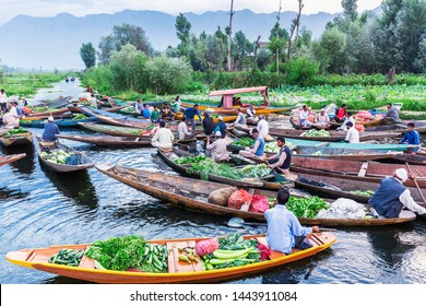 Unidentified Vegetable Vendors Sell Their Produce On Their Boat  At Floating Vegetable Market - Dal Lake, Sri Nagar, India On June 26, 2018 