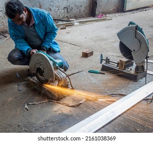 Unidentified Worker Cutting A Metal Strip On 2nd February 2019 In A Factory At Ludhiana, India, Flames And Sparks Coming Out 