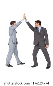 Unified Business Team High Fiving Each Other On White Background