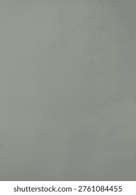 Uniform gray surface with subtle shading variations, appearing neutral and featureless.