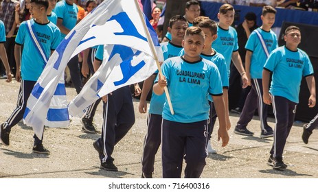 Uniformed In Blue, High School Teens March During Honduras Independence Day Parade At The Town Of La Lima On September 15,2017. 