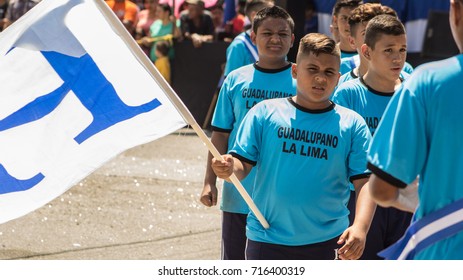 Uniformed In Blue, High School Teens March During Honduras Independence Day Parade At The Town Of La Lima On September 15,2017. 