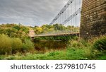 Union Chain Bridge above River Tweed.  The Union Chain Bridge is a suspension road bridge that spans the River Tweed between England and Scotland located four miles upstream of Berwick Upon Tweed