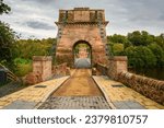 Union Chain Bridge entrance from Scotland.  The Union Chain Bridge is a suspension road bridge that spans the River Tweed between England and Scotland located four miles upstream of Berwick Upon Tweed