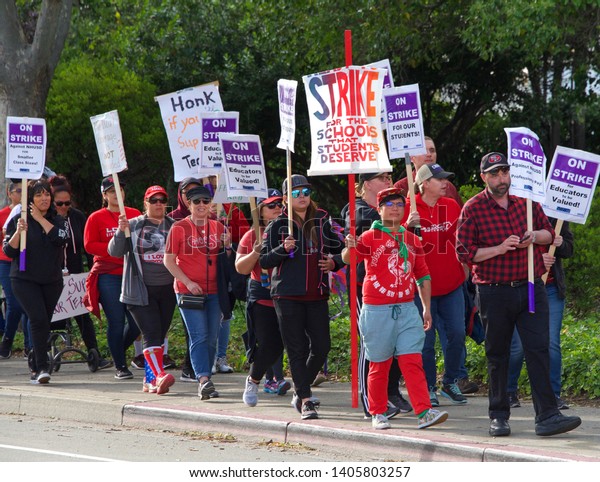 Union City, CA - May 22, 2019: Teachers and\
students march to the New Haven School District Educational\
Services Center to protest. 1st teachers strike ever at New Haven\
Unified’s schools.