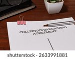 Union Contract Document Set on Tabletop – Representation of Negotiated Labor Rights and Protections