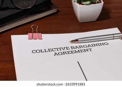 Union Contract Document Set on Tabletop – Representation of Negotiated Labor Rights and Protections