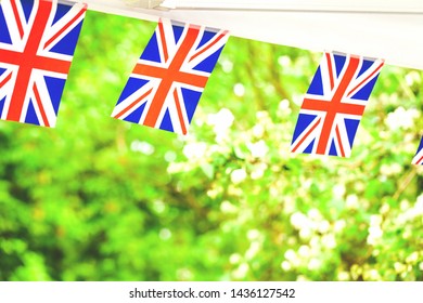 Union Jack British Flags In Summer Garden Party Tent. Celebration In Uk Concept With Copy Space