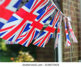 Union Jack bunting outside a suburban English house