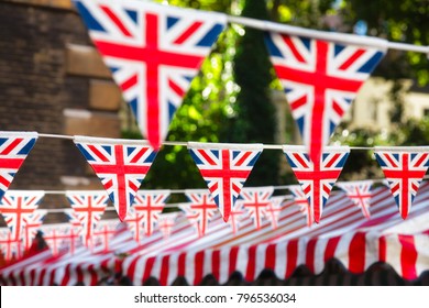 Union Jack flag triangular bunting hanging in a street, a festive decorations in London England UK