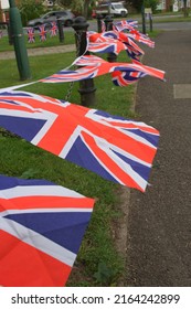 Union Jacks Flutter On An English Village Green