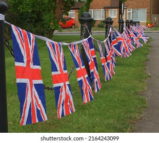 Union Jacks Flutter On An English Village Green