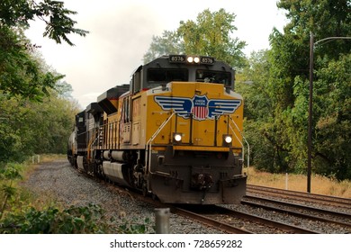 Union Pacific locomotive #8576 leads a Norfolk Southern train past the abandoned Valley Forge Park Train Station in Valley Forge, Pennsylvania. (Photographed: October 5th, 20017) 