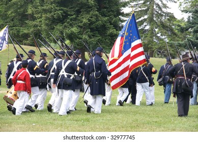 Union troops marching in column formation,   Civil War Battle Re-enactment,  Port Gamble, WA