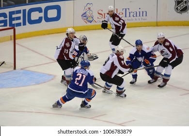 UNIONDALE, NEW YORK, UNITED STATES – FEB 8, 2014: NHL Hockey: Game Action Between The New York Islanders And Colorado Avalanche At Nassau Coliseum. Matt Duchene, #9. Kyle Okposo, #21.