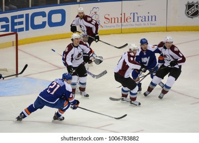 UNIONDALE, NEW YORK, UNITED STATES – FEB 8, 2014: NHL Hockey: Game Action Between The New York Islanders And Colorado Avalanche At Nassau Coliseum. Matt Duchene, #9. Kyle Okposo, #21.