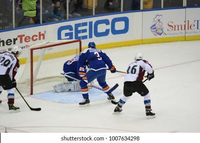 UNIONDALE, NEW YORK, UNITED STATES – FEB 8, 2014: NHL Hockey: Paul Stastny #26 And Nathan MacKinnon #29, Of The Colorado Avalanche, Press The Play Against  The New York Islanders At Nassau Coliseum.