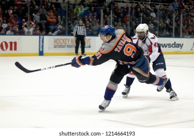 UNIONDALE, NEW YORK, UNITED STATES – March 9, 2013: NHL Hockey: John Tavares Of The New York Islanders Shoots The Puck Against The Washington Capitals At Nassau Coliseum. 