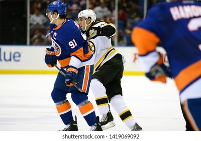 UNIONDALE, NEW YORK, UNITED STATES – Nov. 2, 2013: NHL Hockey: Game Action Between The Boston Bruins And New York Islanders At Nassau Coliseum. Patrice Bergeron #37. John Tavares #91.