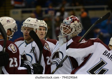 UNIONDALE, NEW YORK, UNITED STATES – FEB 8, 2014: NHL Hockey: Colorado Avalanche Players Celebrate After Defeating The New York Islanders At Nassau Coliseum. Nathan MacKinnon, Jean-Sebastien Giguere.