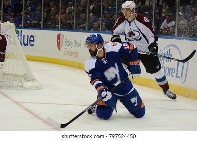 UNIONDALE, NEW YORK, UNITED STATES – FEB 8, 2014: NHL Hockey: Cal Clutterbuck, (New York Islanders) During A Game Against The Colorado Avalanche At Nassau Coliseum. Nick Holden, #2.