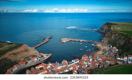 Unique aerial drone photo taken above the Staithes town in North Yorkshire - Shutterstock ID 2353895525