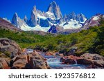 A unique and beautiful scenery: a blue river in El Chaltén, Patagonia, and Mount Fitz Roy in the background. Located at the Southern Patagonic Andes between Chile and Argentina. 