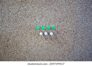 Unique composition symbolize teamwork, precision, and a structured mindset. Green pins represent growth and innovation, while the white pins symbolize clarity and simplicity.