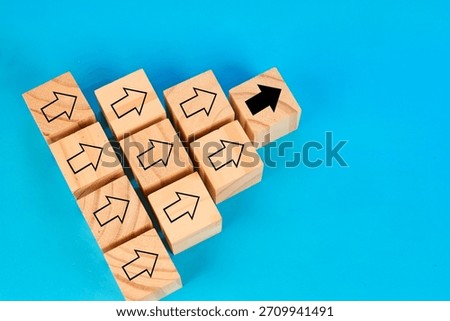 A unique direction concept showing one highlighted block leading a structured group symbolizing initiative leadership and guided progress.

