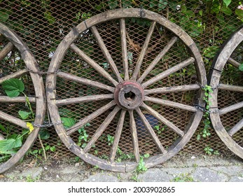 Unique fence from old wagon wheel.